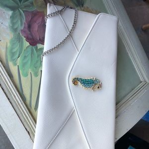 Beaded purple purse and White Sea horse purse